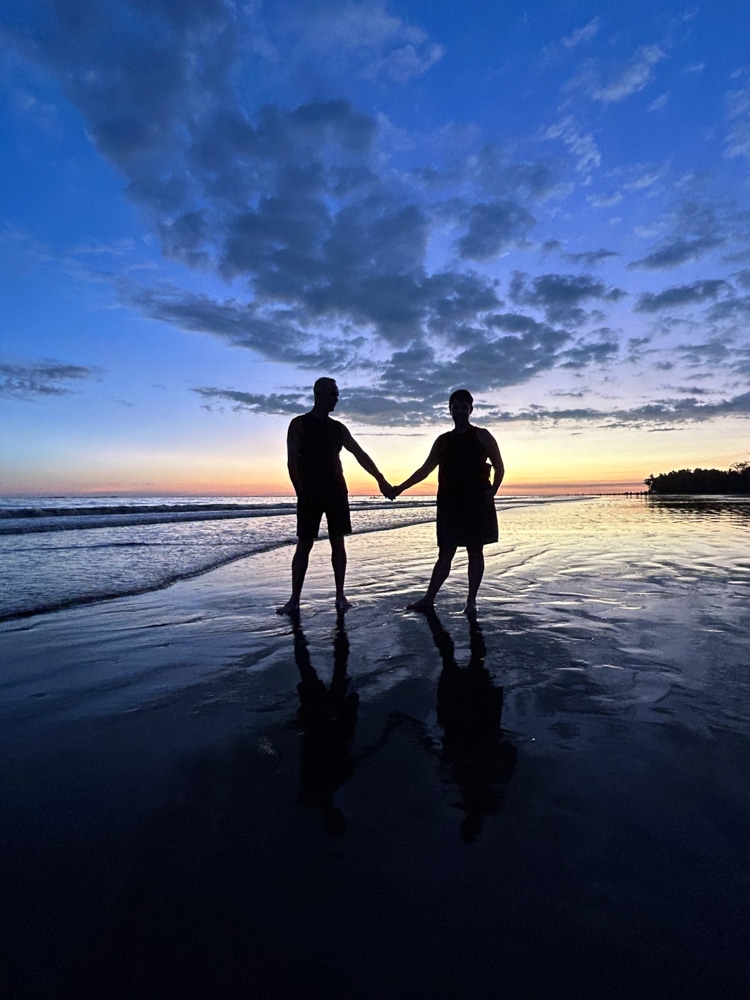 Edmonton event photographer Bruce Clarke poses with his wife Sarah on a beach in Costa Rica