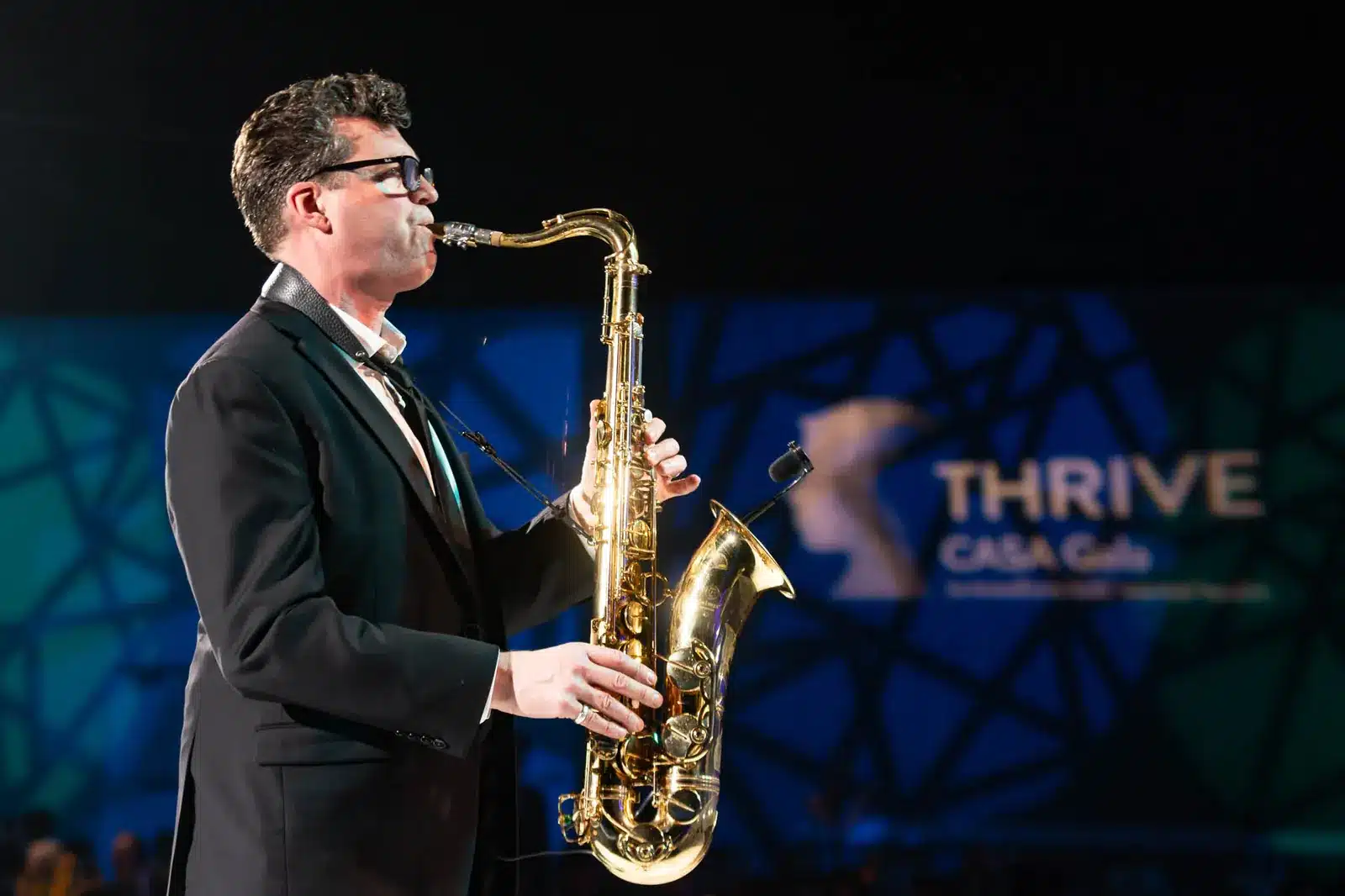 Live saxophone performer entertaining guests at an Edmonton gala event