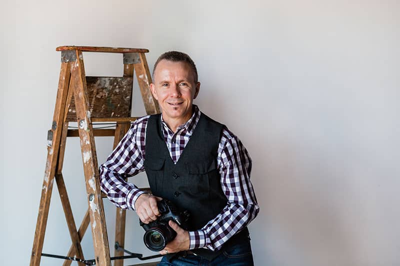 edmonton-event-photographer-bruce-clarke-2 Edmonton photographer Bruce Clarke poses for a photo in the studio
